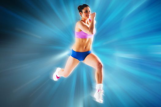 Fit brunette running and jumping against abstract background