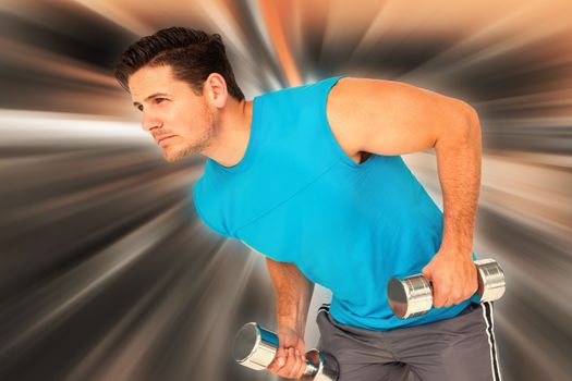 Fit young man exercising with dumbbells against abstract background