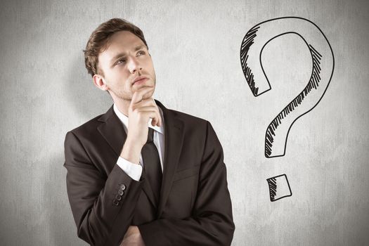 Young businessman thinking with hand on chin against white background