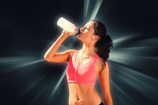 Beautiful healthy woman drinking water against abstract background