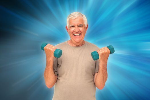 Portrait of a happy senior man exercising with dumbbells against abstract background