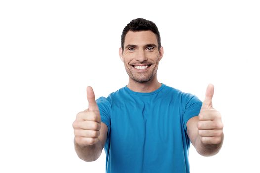 Smiling guy showing double thumbs up