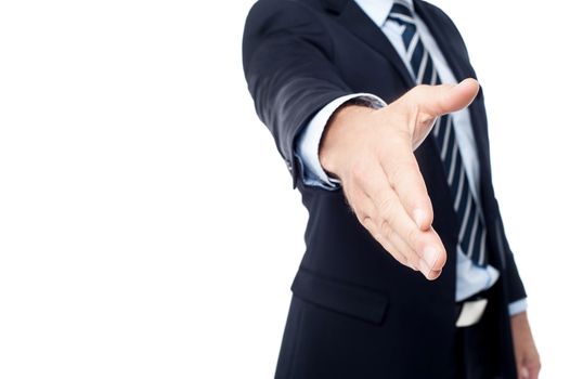 Cropped image of businessman extending hand to shake