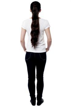 Full length image of young woman from back