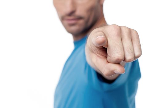 Casual man pointing to camera, cropped image.