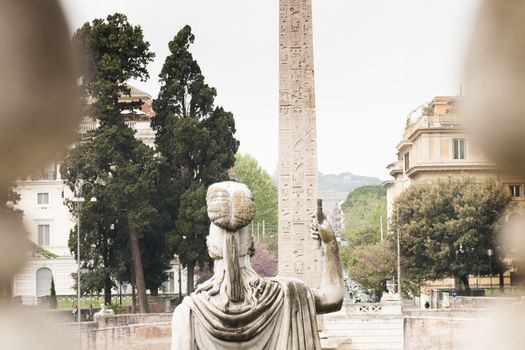 statue of the goddess Roma socket shoulder shooting through the columns.