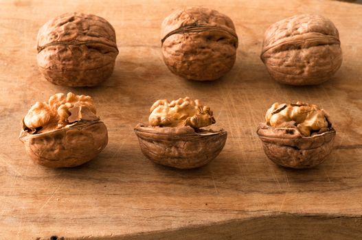 pile of walnuts in the foreground represent a healthy diet