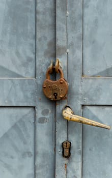 Picture of an Old vintage lock on a metal door