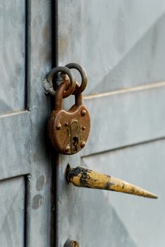 Picture of an Old vintage lock on a metal door