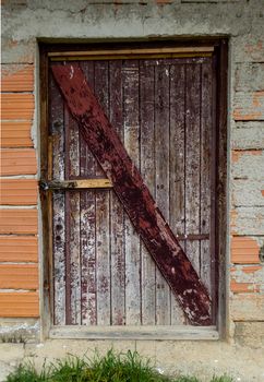 Picture of an  Old    wooden door with peeled paint