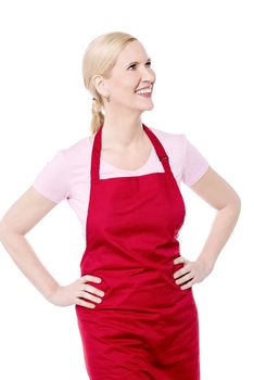 Female cook looking up with hands on her waist