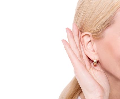 Closeup image of nosy woman hand to ear gesture