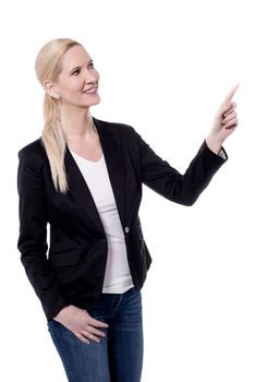 Happy business woman pointing at copyspace