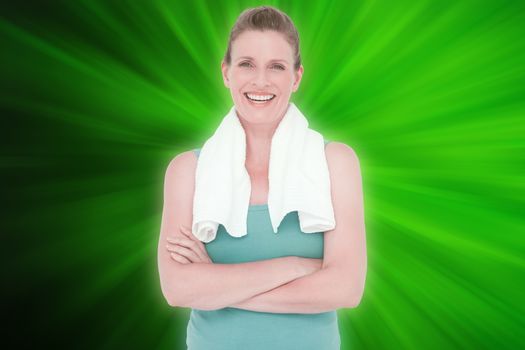 Fit woman with towel on shoulders against abstract background