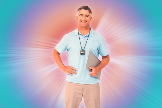 Trainer smiling at the camera against abstract background