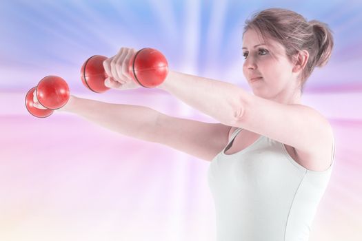 Woman holding weights against abstract background