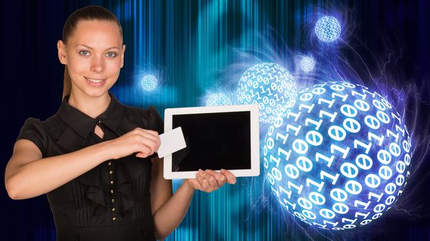 Smiling young woman holging tablet and blank card and looking at camera on abstract digital background with numbers