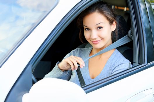 Always fasten your seatbelt. Girl in a car