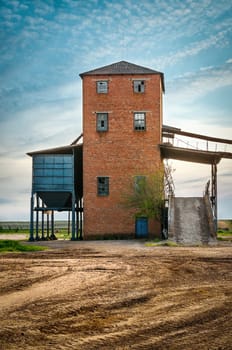 Old barn on background the blue sky