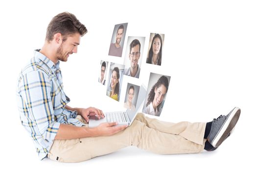 Handsome young man sitting using laptop against profile pictures