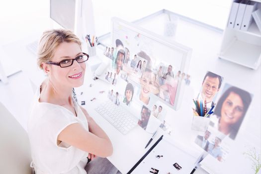 Creative team going over contact sheets in meeting against business people