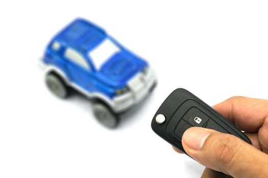 Closeup of male hand holding remote control car key