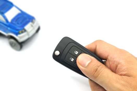 Closeup of male hand holding remote control car key