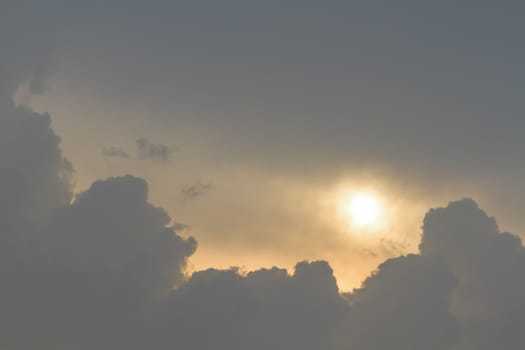 Sun and clouds on sky background