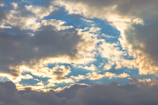 Clouds at sunset on sky background