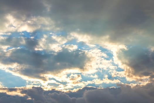 Clouds at sunset on sky background