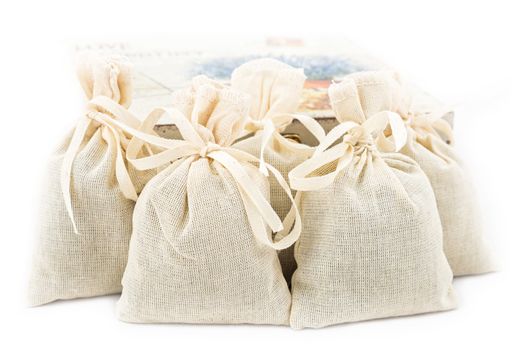 Textile sachet pouches on white background