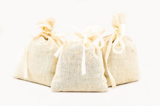 Textile sachet pouches on white background