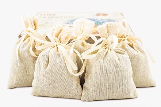 Textile sachet pouches with gift box on white background