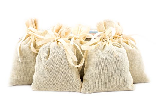 Textile sachet pouches on white background