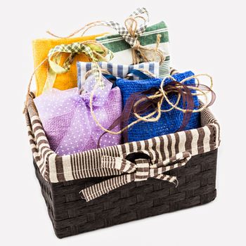 Decorative textile sachet pouches in gift box on white background
