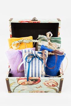Decorative textile sachet pouches in gift box on white background