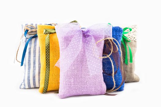 Decorative textile sachet pouches on white background