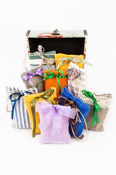 Decorative textile sachet pouches with gift box on white background