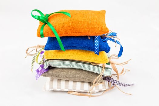 Decorative textile sachet pouches on white background