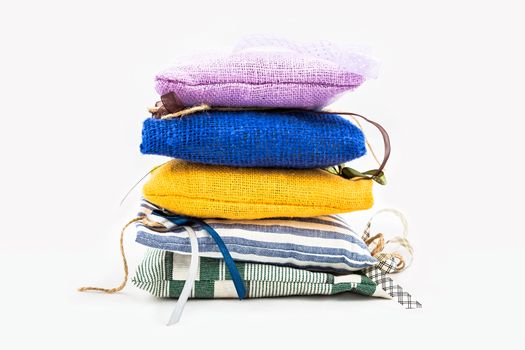 Decorative textile sachet pouches on white background