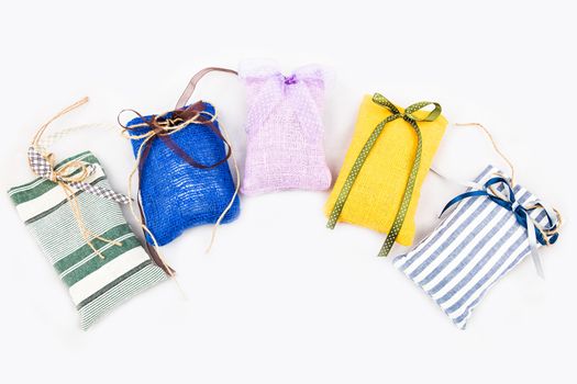 Decorative textile sachet pouches on white background