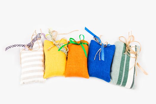 Decorative textile sachet pouches on white background