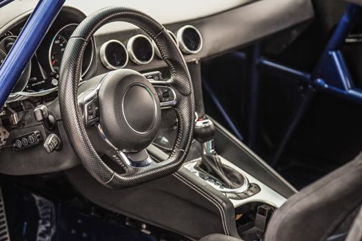 Steering wheel in interior of the sports car