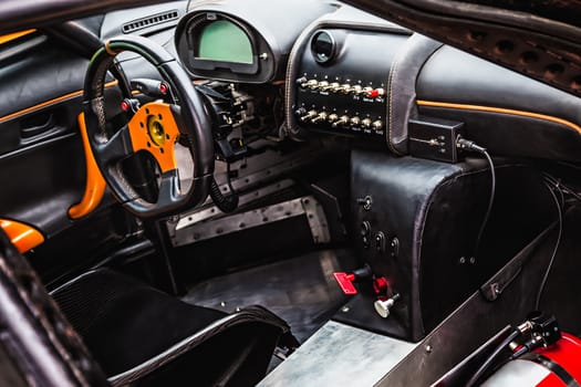 Steering wheel and dashboard in interior of the sports car