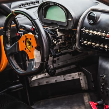 Steering wheel and dashboard in interior of the sports car