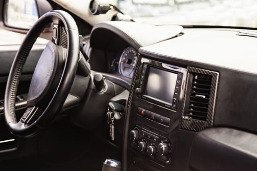 Steering wheel and dashboard in interior of the sports car