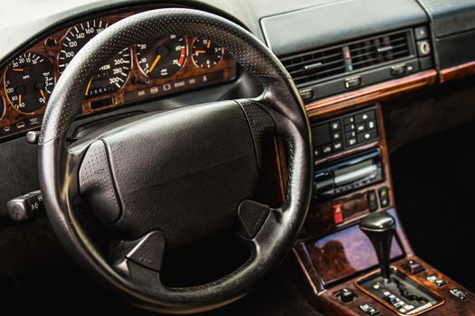 Steering wheel and dashboard in interior of the sports car