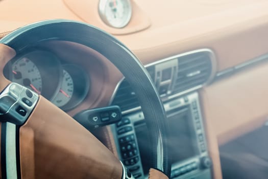 Steering wheel in interior of the sports car