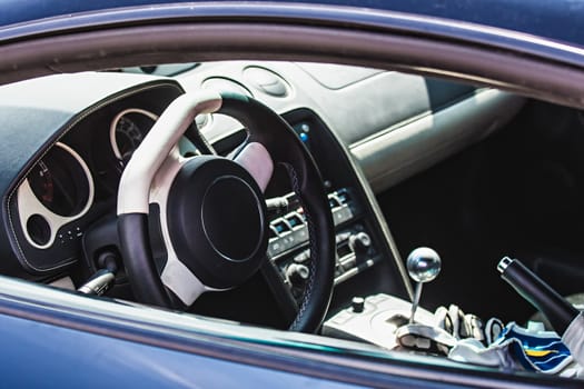 Steering wheel in interior of the sports car