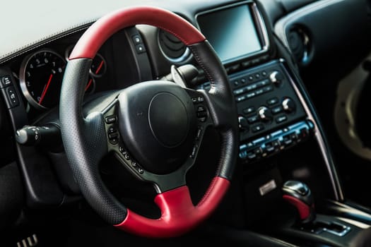 Steering wheel and dashboard in interior of the sports car